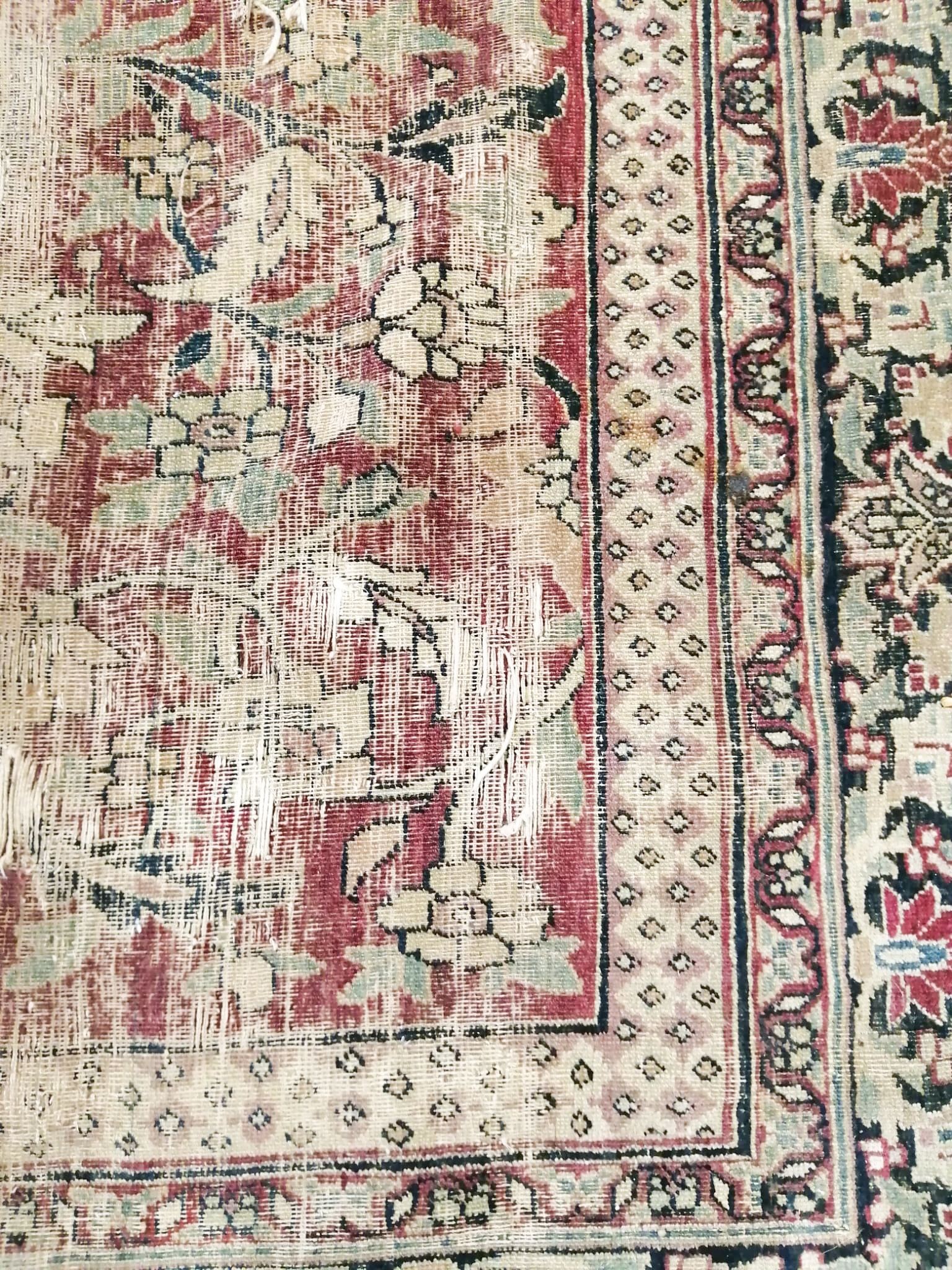 An antique Kashan blue ground carpet (worn and holed) 410 x 300cm